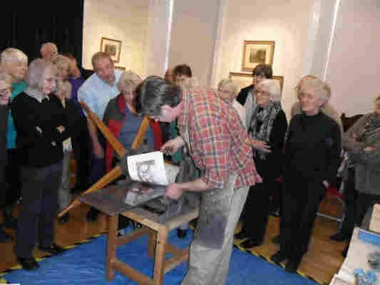 David Adam giving an etching demonstration on David Waterson's bench etching press.